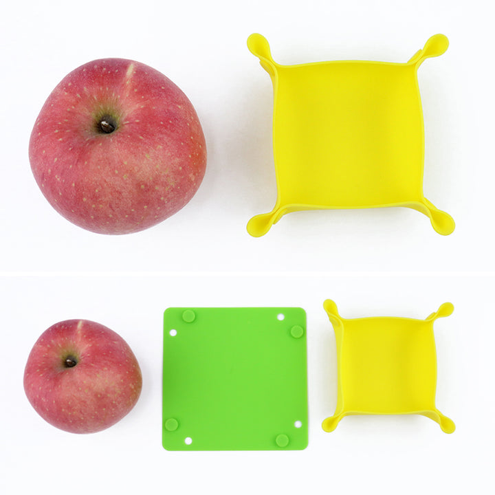 Foldable silicone tray size comparison with apple - large and small sizes in yellow and green